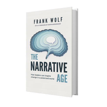 Stacks of Frank Wolf's book the Narrative Age at the VOICES Berlin event in April of 2024.